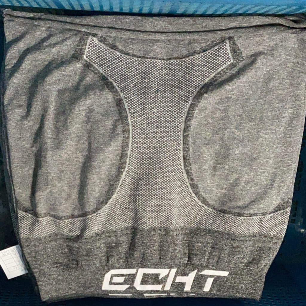 Seamless activewear fabric detail typically produced by an ECHT manufacturer showing custom logo jacquard structure.