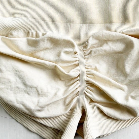 Detail shot of finalized seamless scrunch bum leggings showing lifting effect and knitting quality by an Australian Activewear Manufacturing Partner.